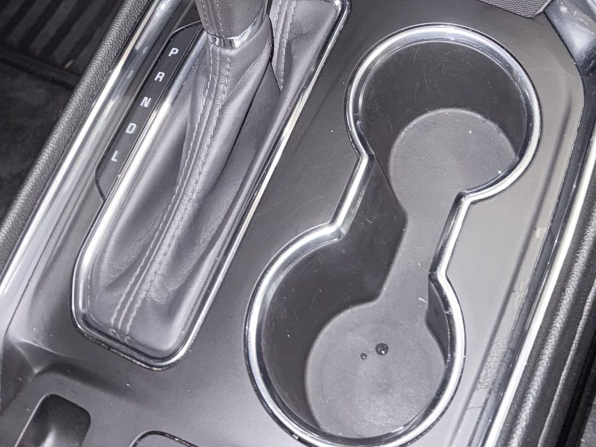 The same centre console after a full Shoreless Detailing interior service