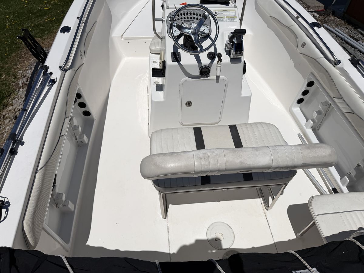 The same deck, helm and seating after a full interior detail, cleaned and brightened