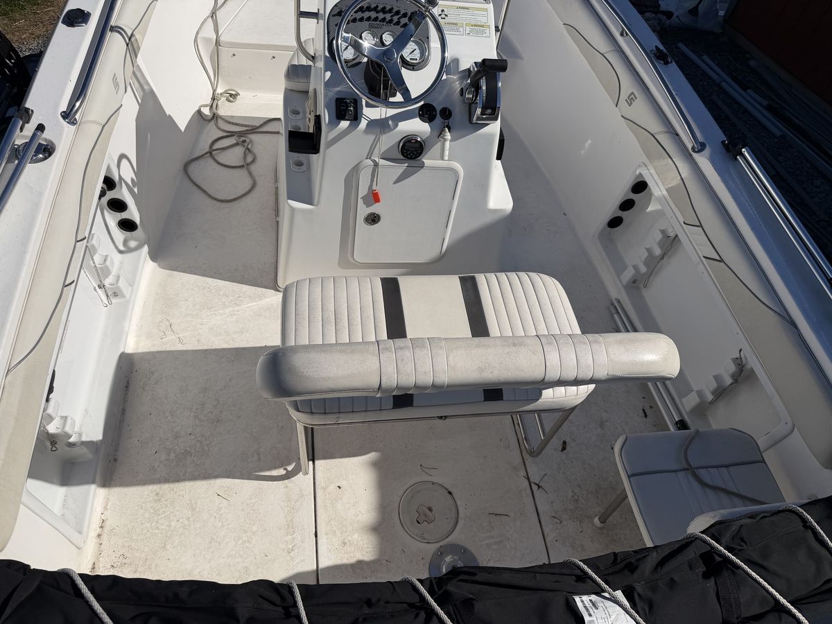 Boat deck, helm and seating before detailing, with dirt worked into the non-skid and vinyl