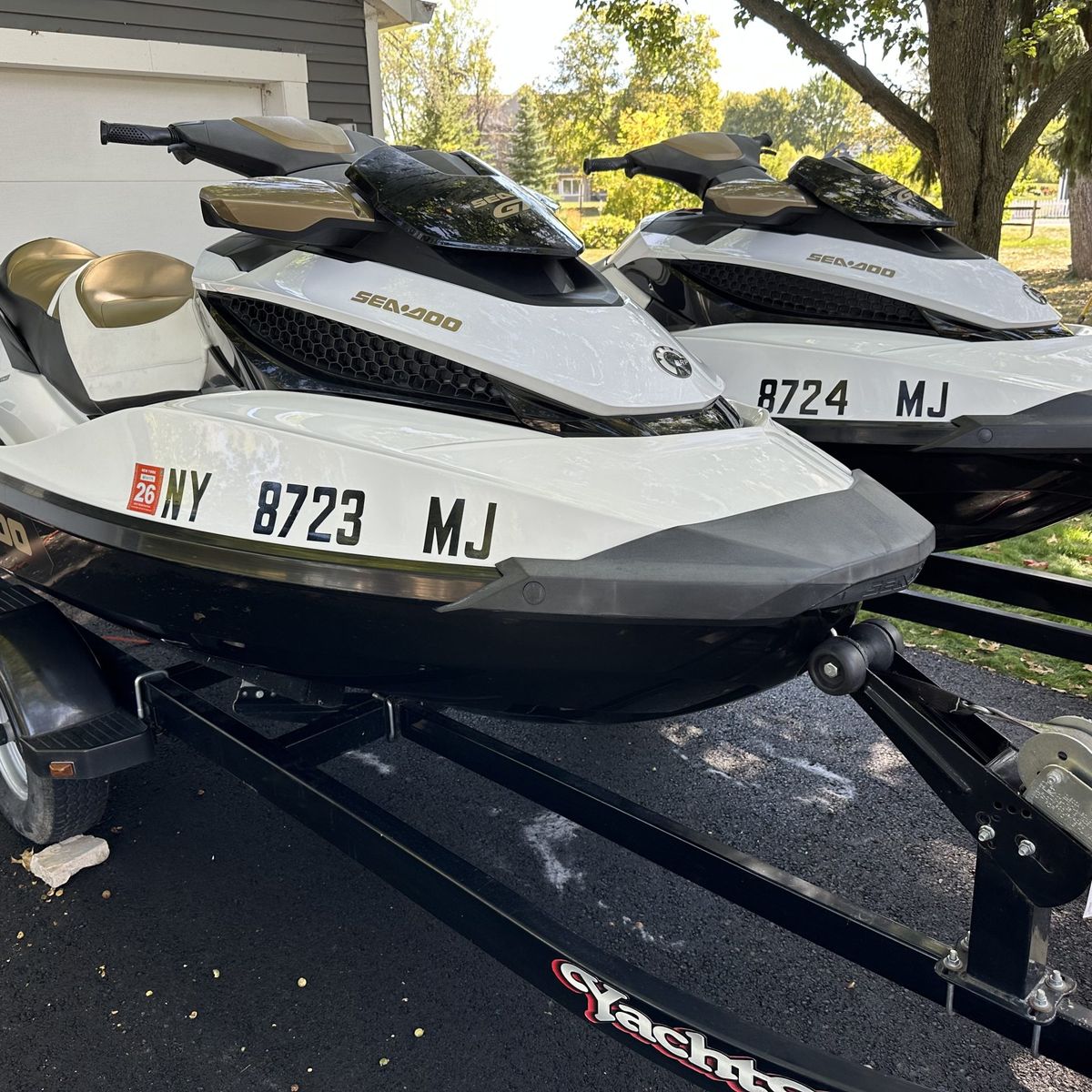 Two Sea-Doo jetskis detailed and loaded on their trailer
