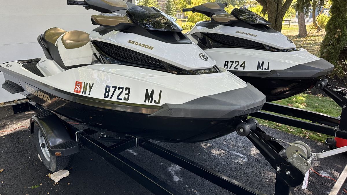 Two detailed Sea-Doo jetskis on their trailer after a Shoreless Detailing service